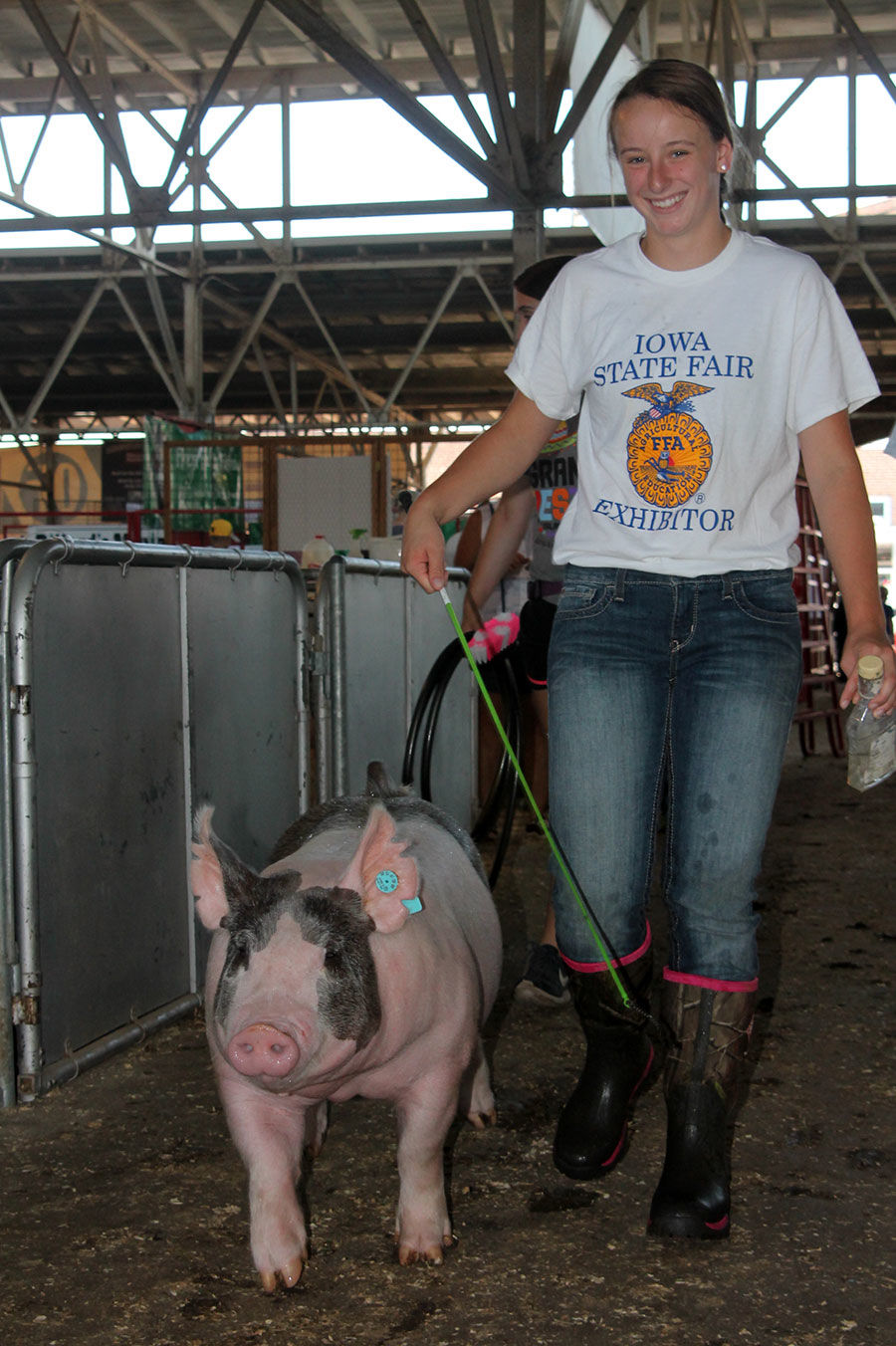 Jayden Jorgensen, 17, of Rudd, guides her hog to the show ring.